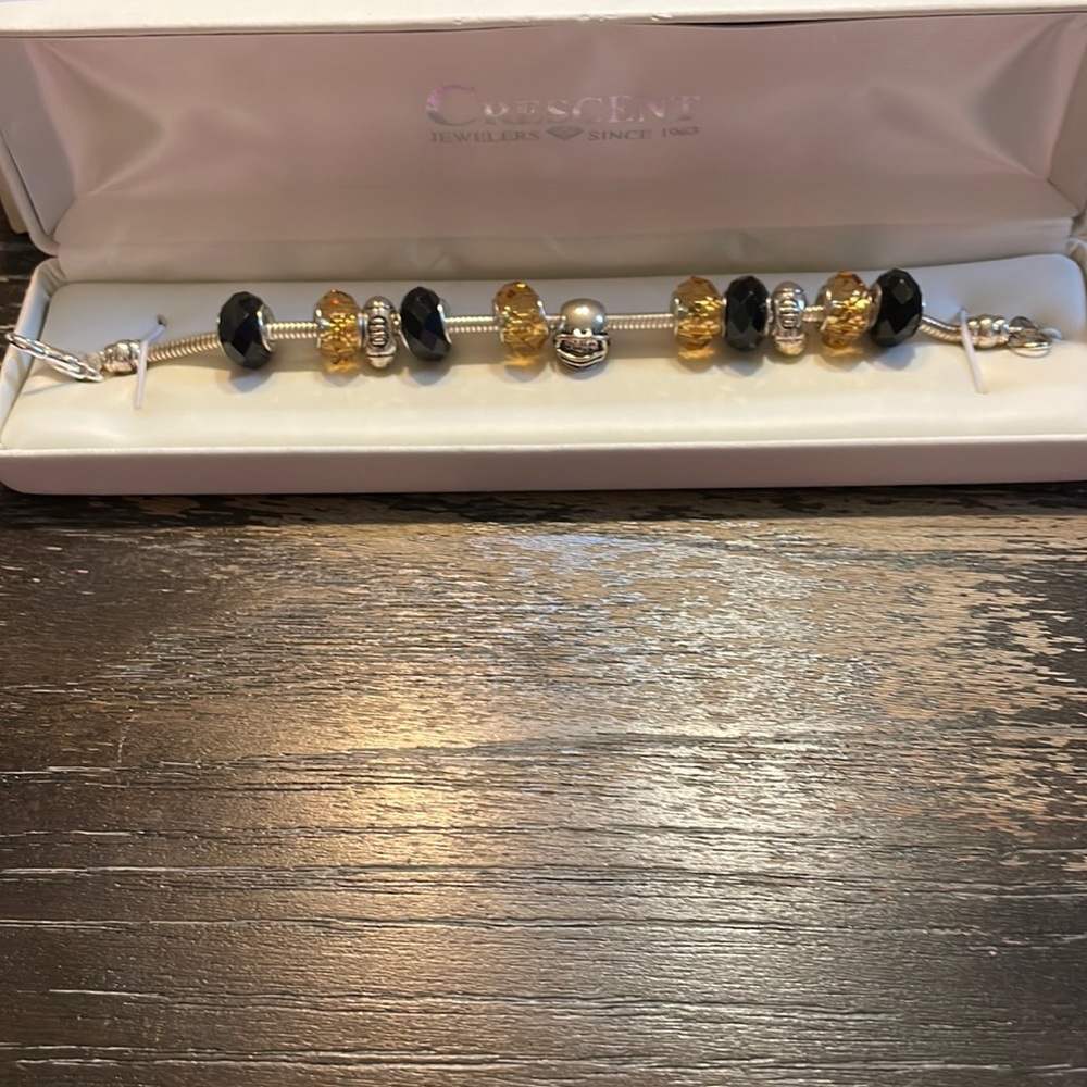 Football charm bracelet.  New.  Still in box.  Never Worn